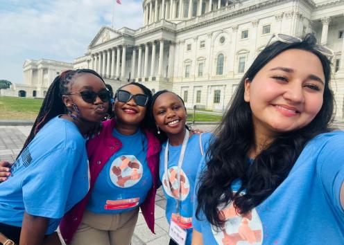 4 participants smiling at Washington DC for selfie